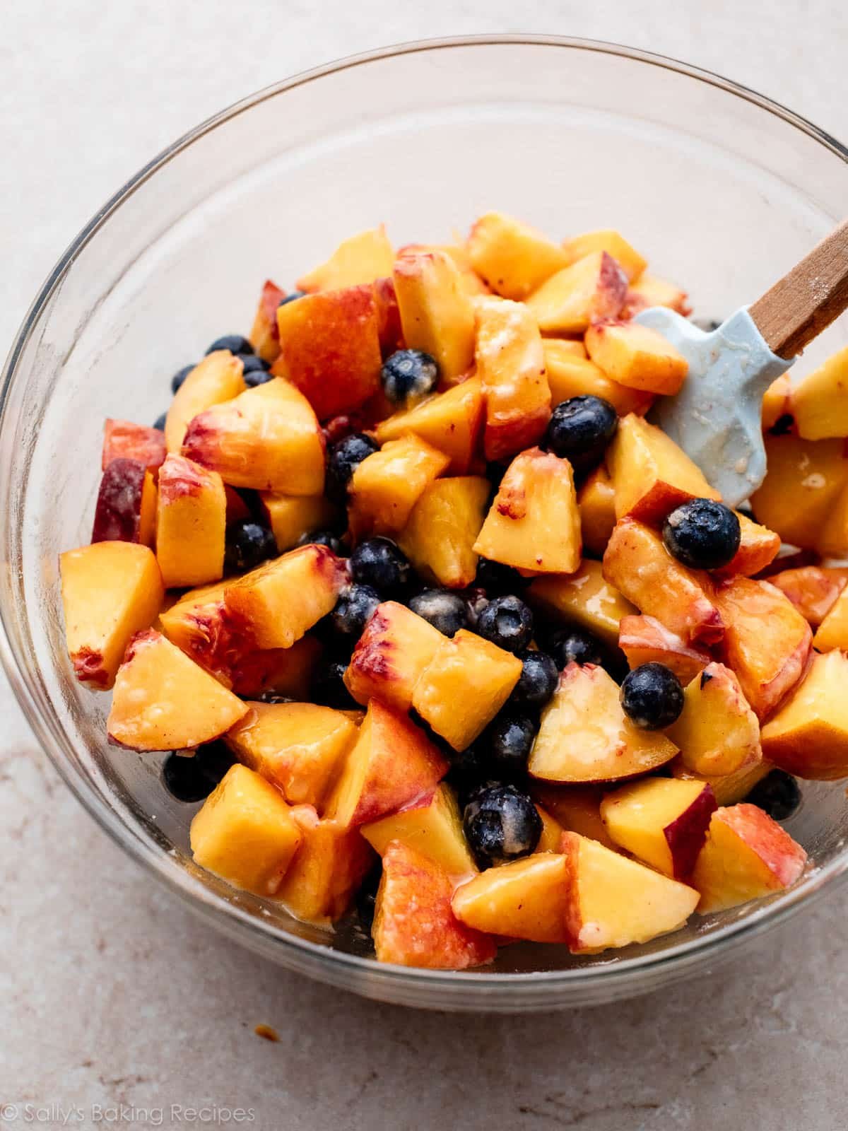 sugared peaches in bowl.