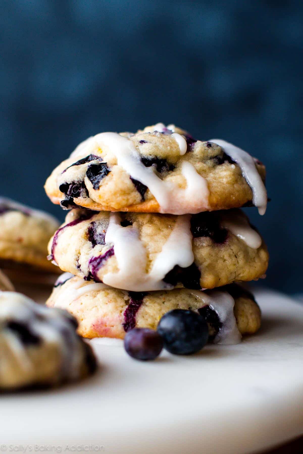 stack of blueberry muffin cookies with lemon glaze