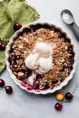 bourbon cherry crisp with ice cream on top