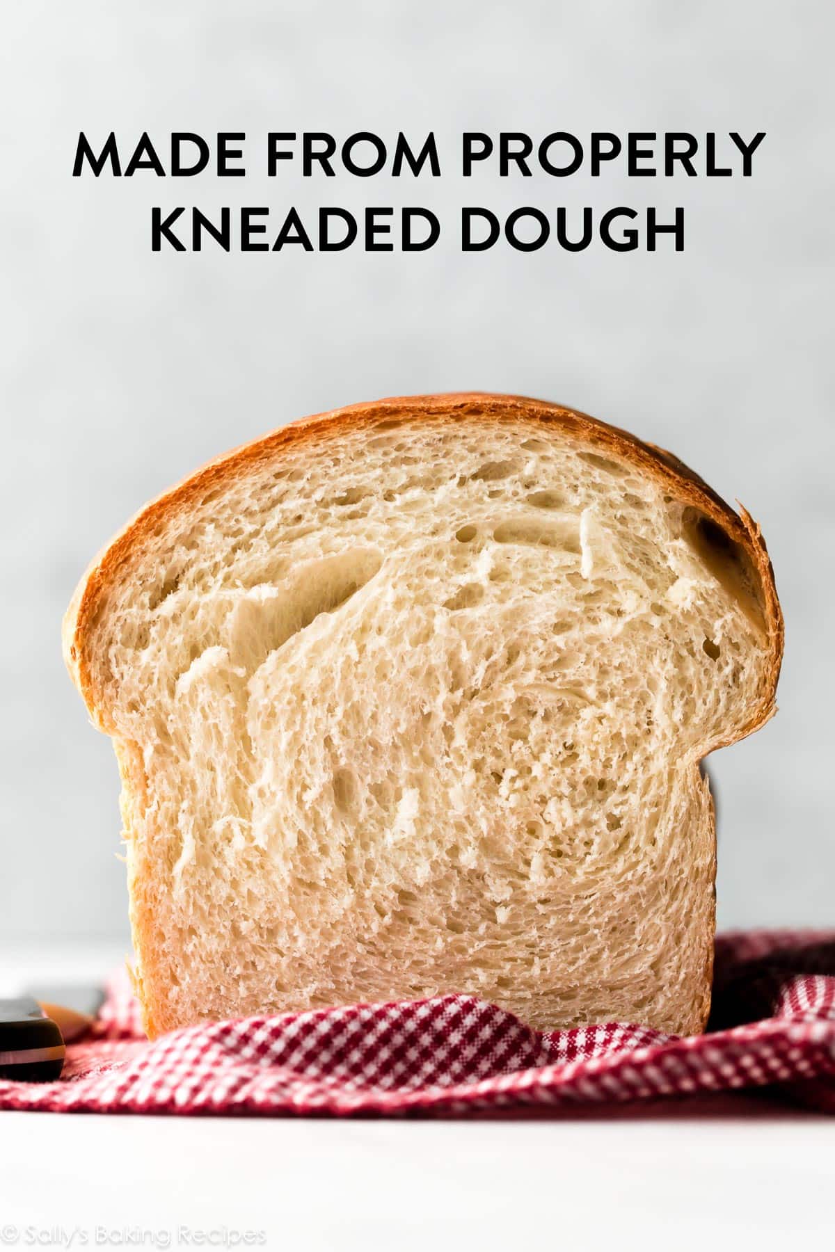 loaf of bread cut to show perfectly fluffy and airy crumb inside.