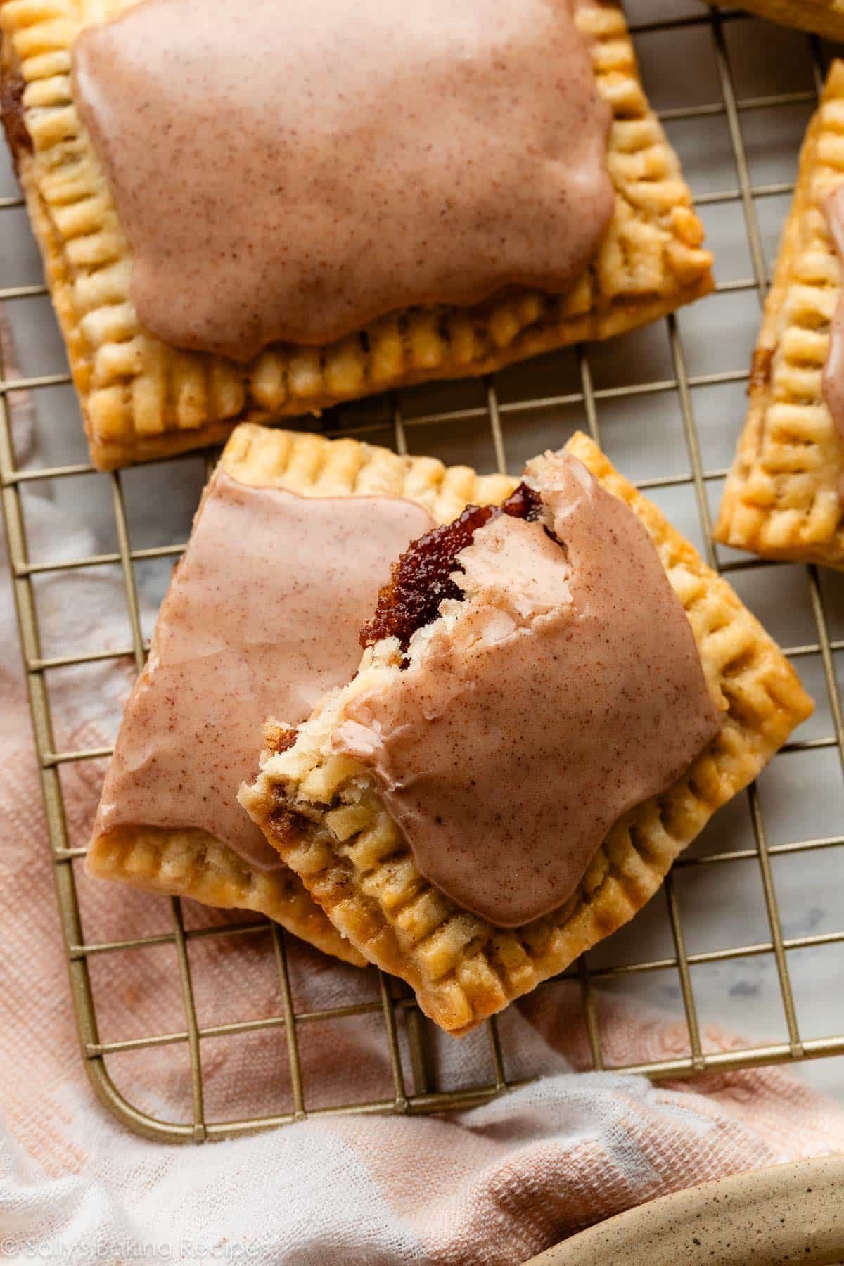 homemade brown sugar pop tart broken in half to show cinnamon filling.