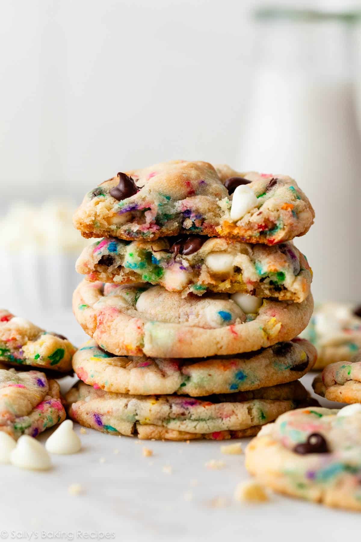 stack of cake batter chocolate chip cookies with sprinkles and chocolate chips.