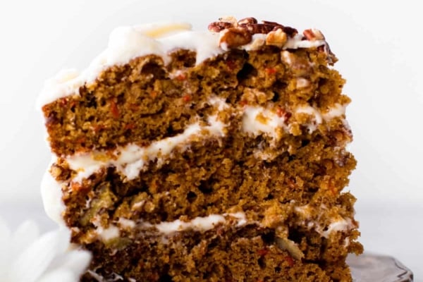 slice of carrot cake with cream cheese frosting on a plate