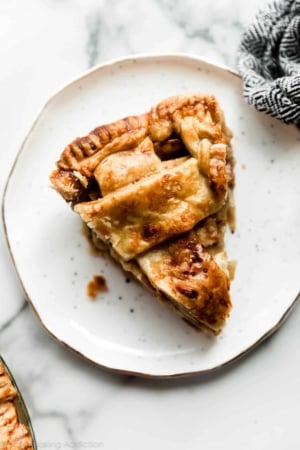 slice of apple cheddar pie on a white plate