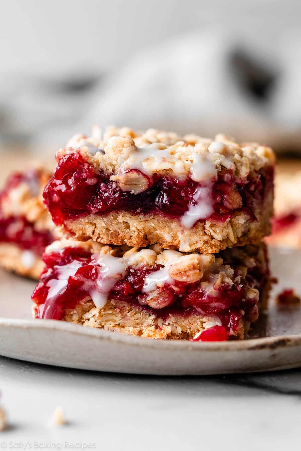 stack of 2 cherry pie bars with icing.