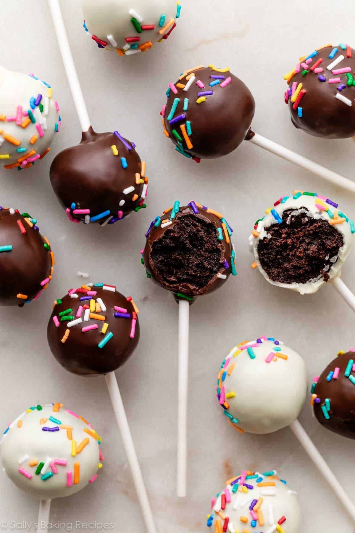 chocolate cake pops dipped in chocolate and white chocolate with rainbow sprinkles.