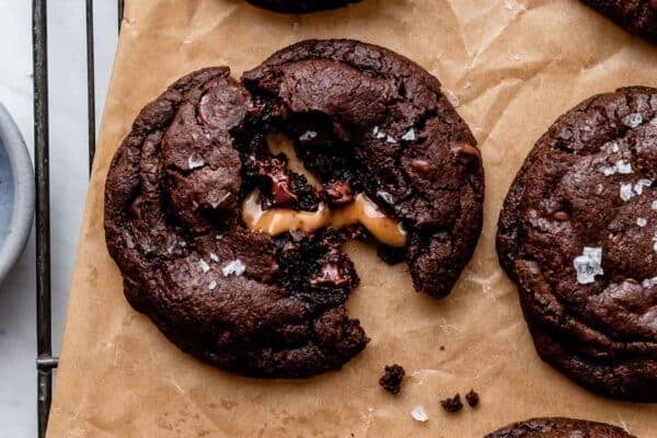 salted caramel dark chocolate cookies on brown parchment paper.