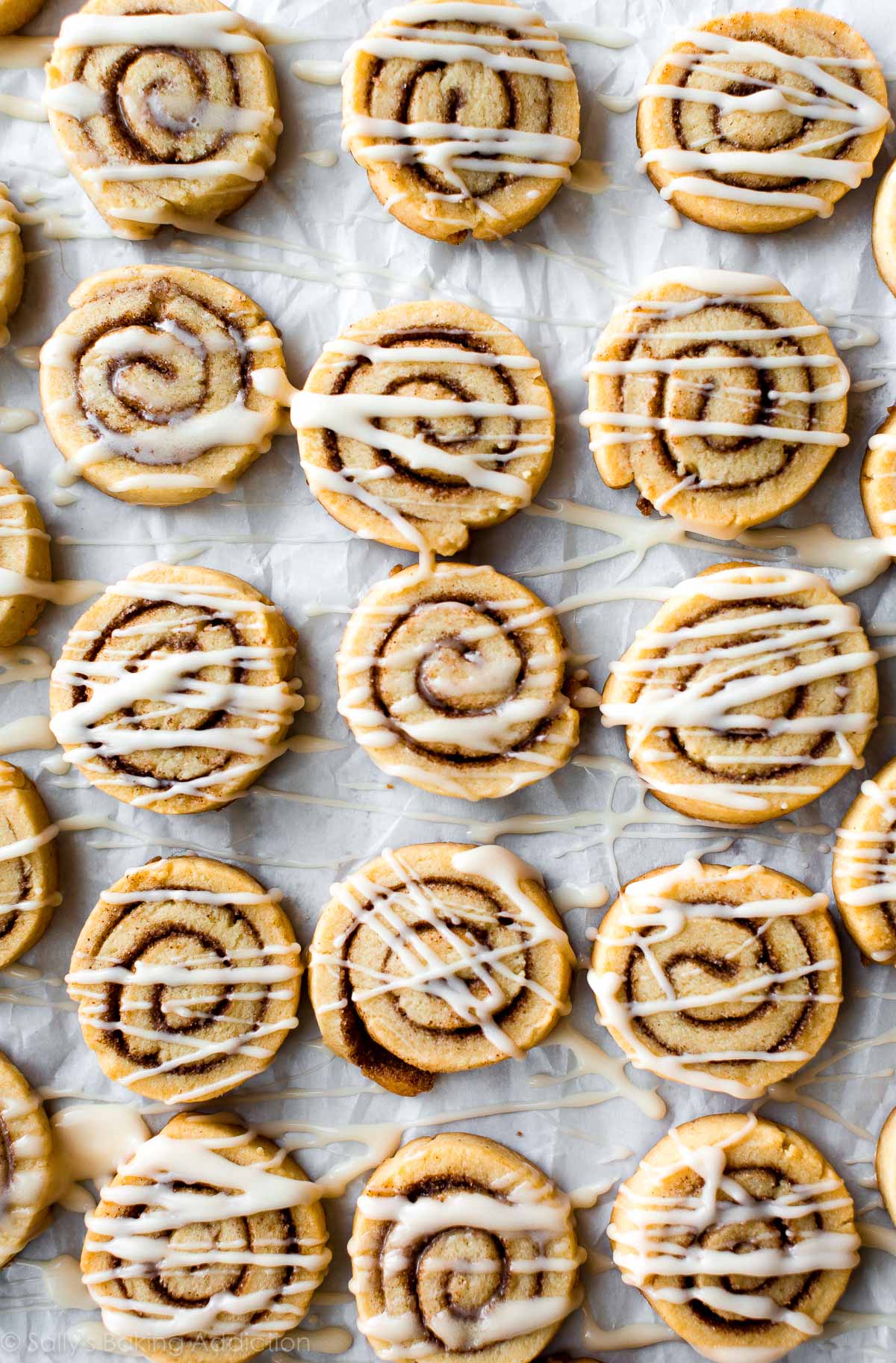 cinnamon roll sugar cookies with vanilla icing