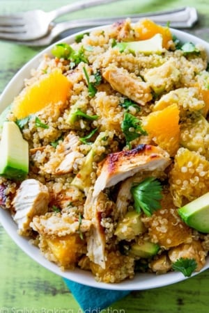 citrus chicken quinoa salad in a white bowl