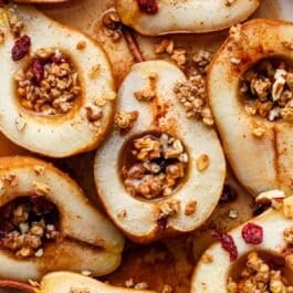 baked pears with maple syrup, cinnamon, and granola.