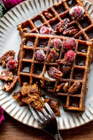 fork removing bite of gingerbread waffles.