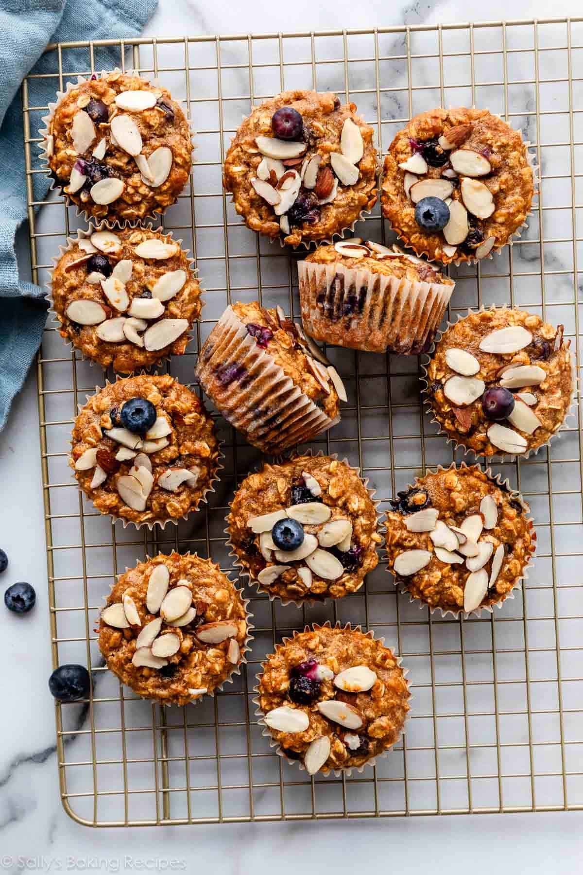 overhead photo of blueberry almond muffins on a wire cooling rack.