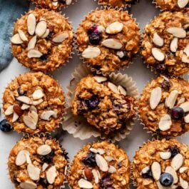 gluten free blueberry almond muffins with fresh blueberries and sliced almonds.