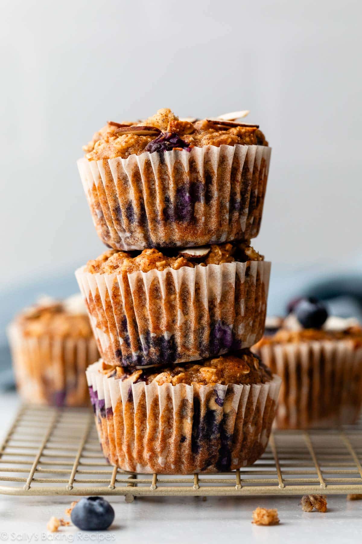 stack of 3 almond butter oatmeal blueberry muffins.