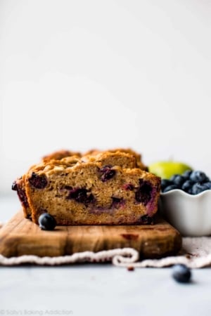 healthy apple blueberry bread on a wood serving tray