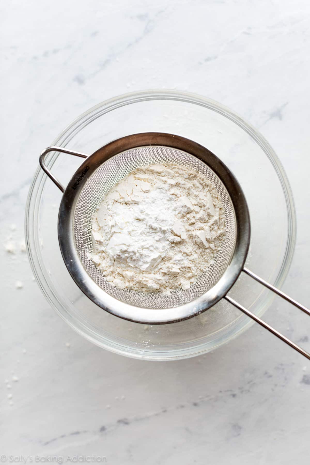 homemade cake flour substitute in fine mesh sieve