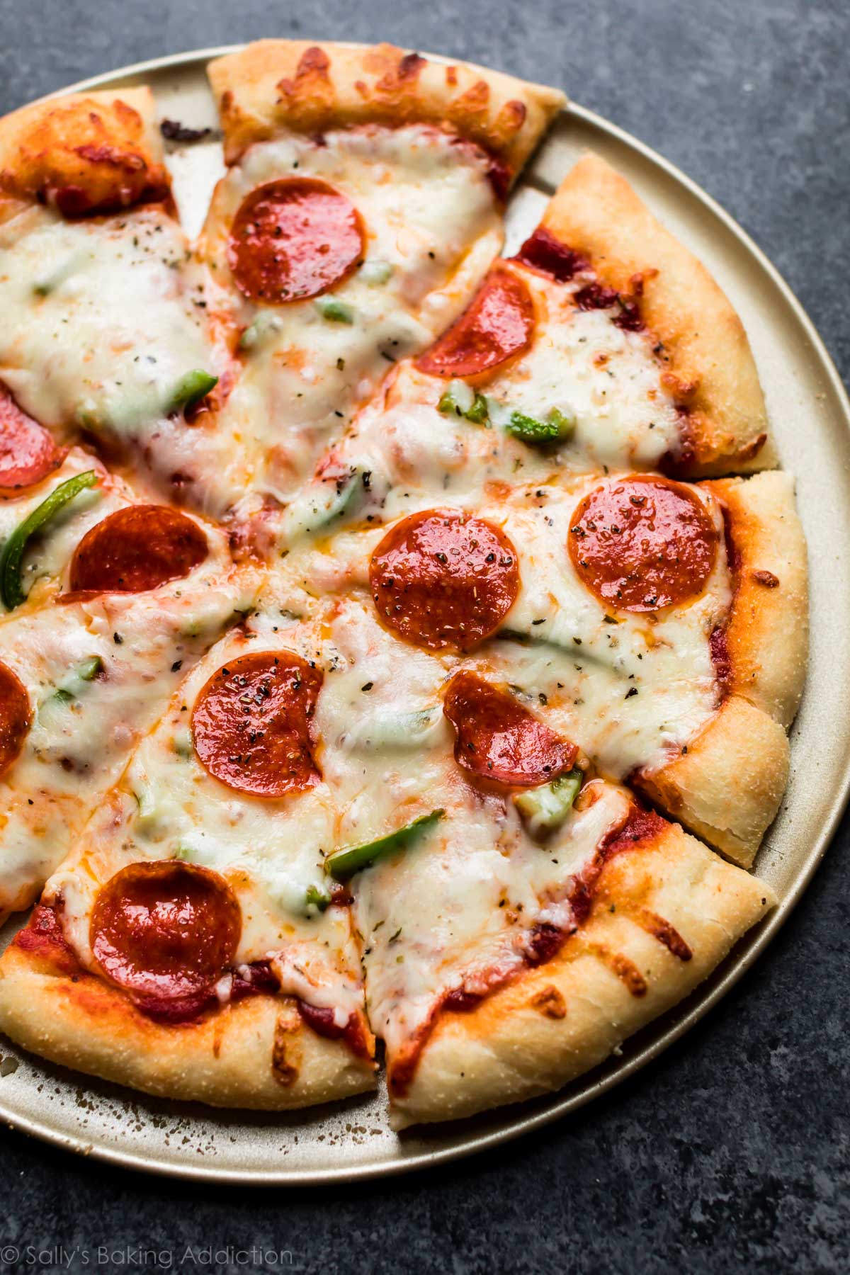 Homemade pepperoni cheese pizza cut into slices