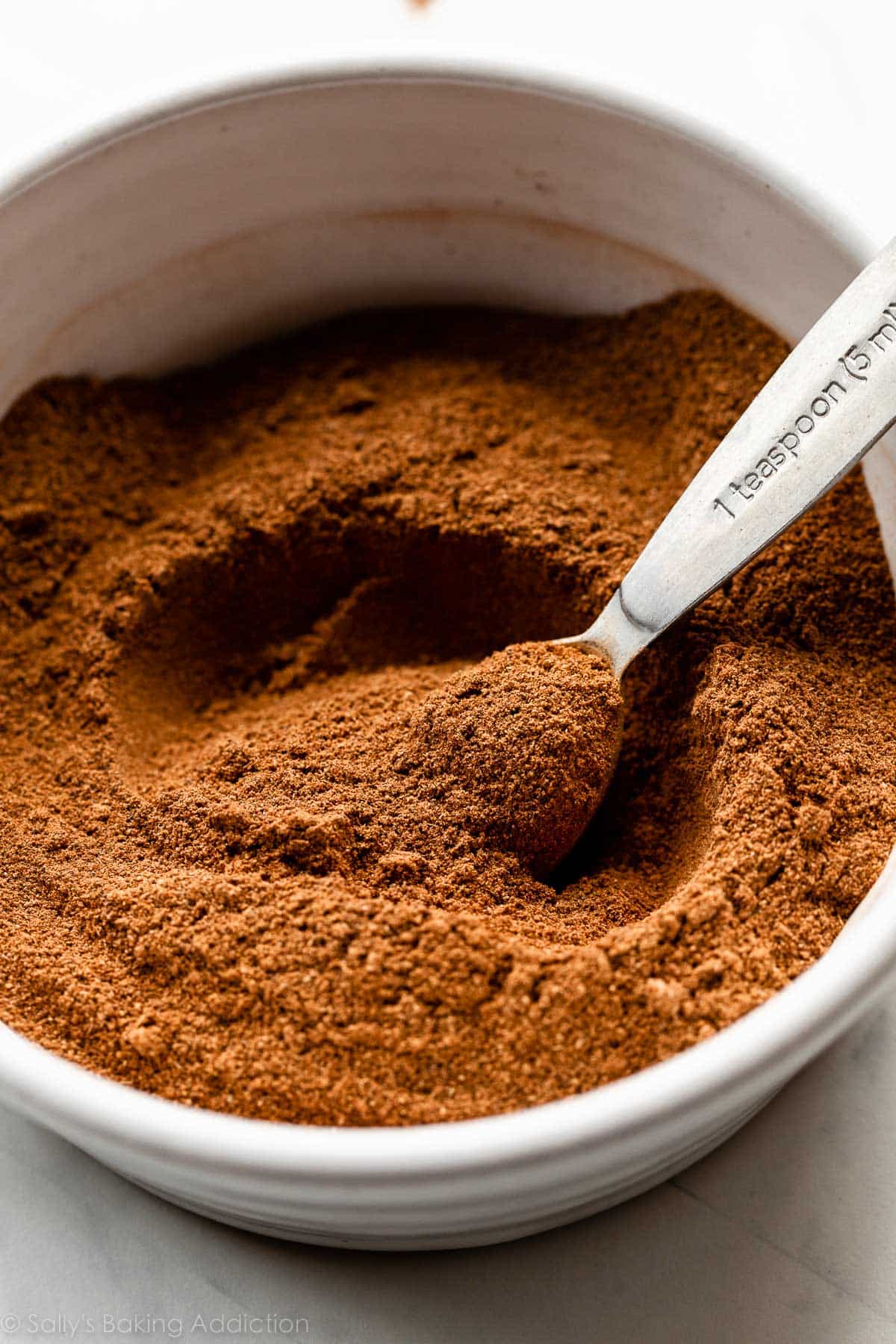 big white bowl of homemade pumpkin pie spice.