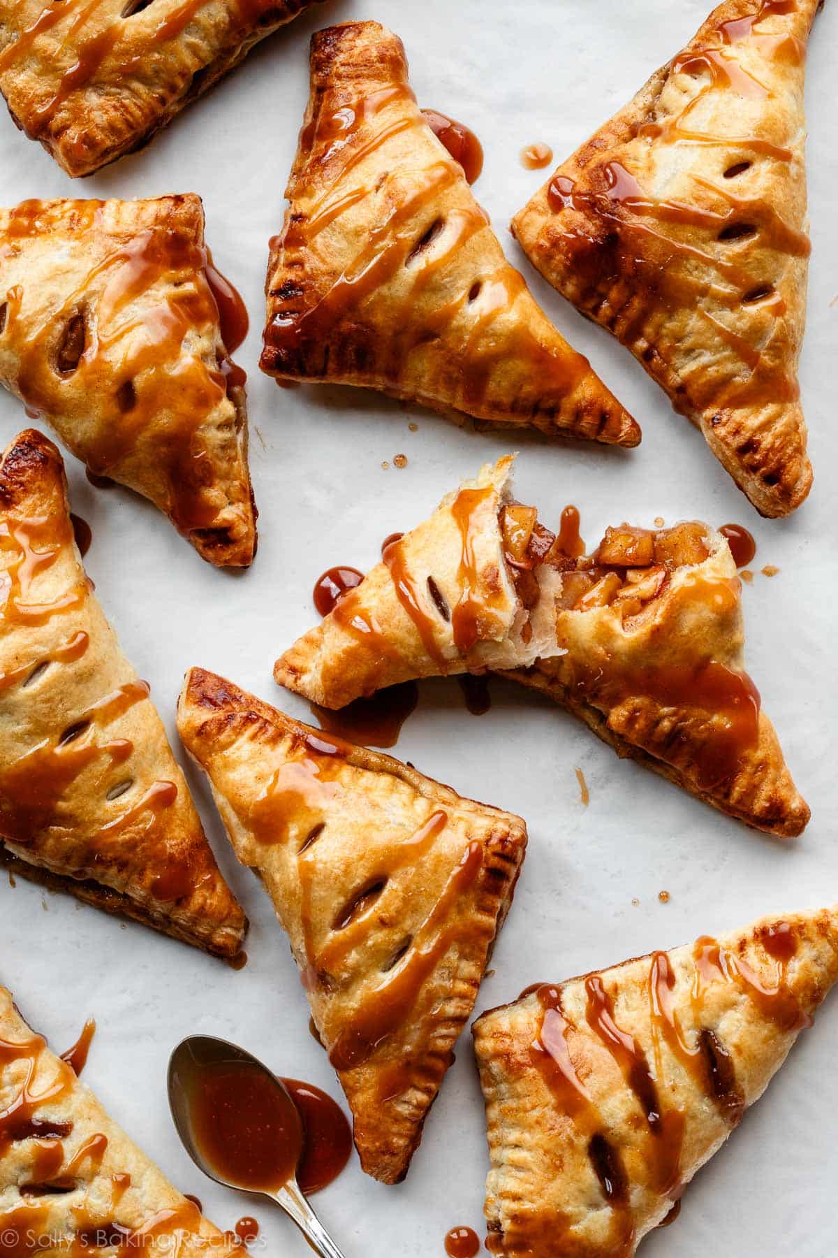 caramel apple turnovers with spoonful of caramel.