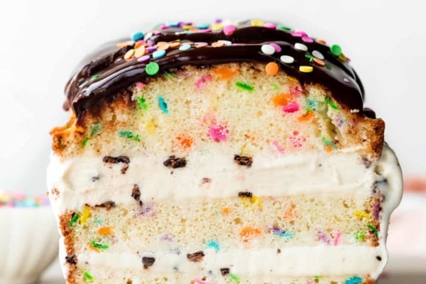 ice cream layered loaf cake with chocolate ganache and sprinkles