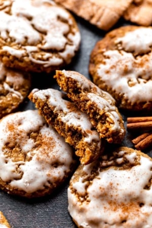 gingerbread oatmeal cookies with icing and cinnamon on top