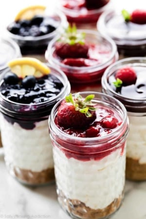 individual no bake cheesecake jars with assorted toppings