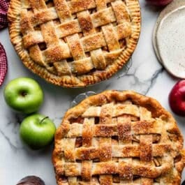 two apple pies shown with lattice pie crust tops and one with a crimped pie crust edge and another with a fluted pie crust edge.