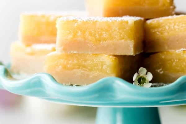 Lemon bars on teal cake stand