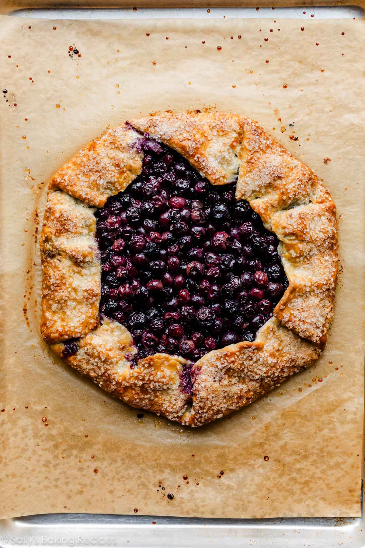 blueberry galette on parchment paper-lined baking sheet.