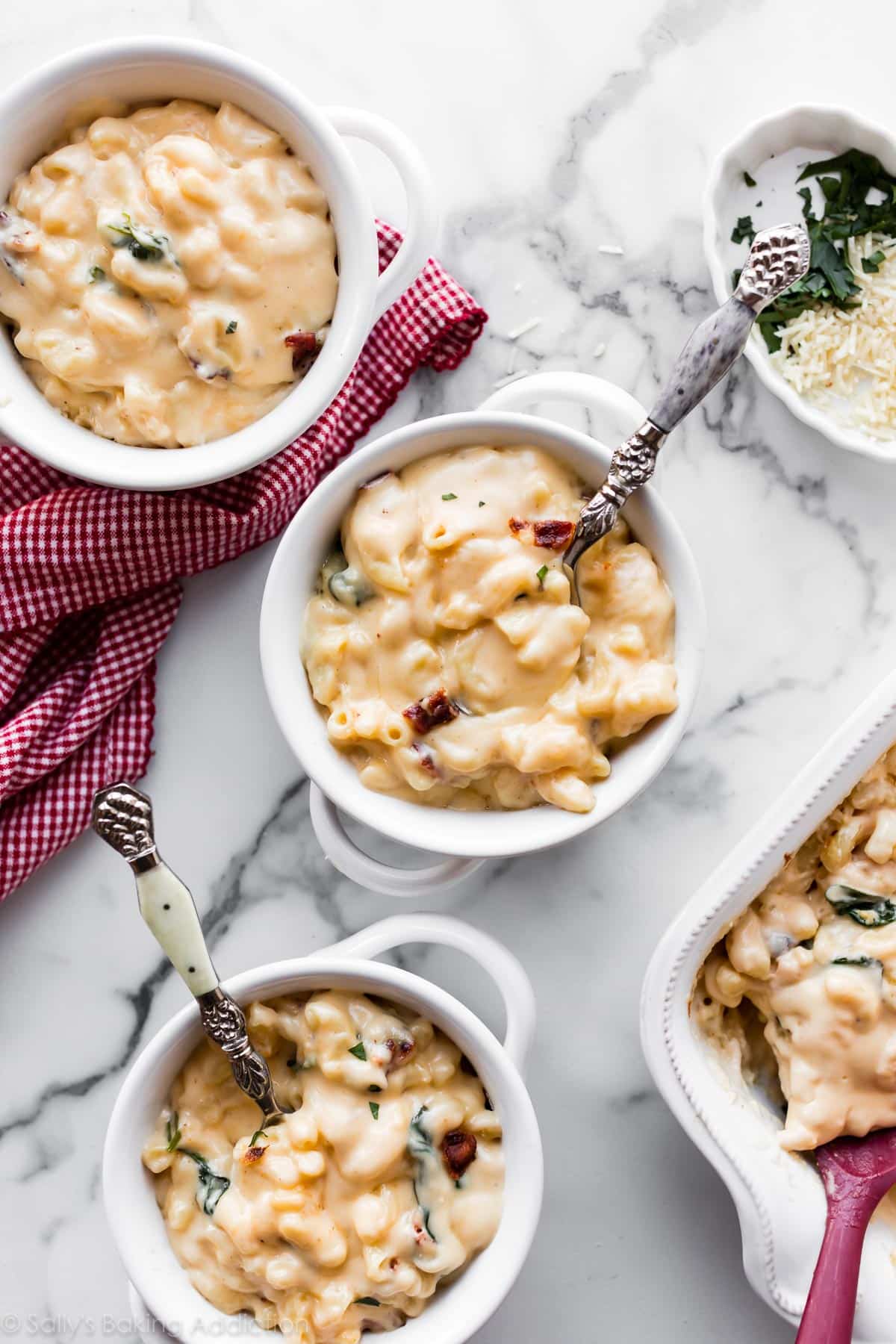 3 white bowls of homemade mac and cheese