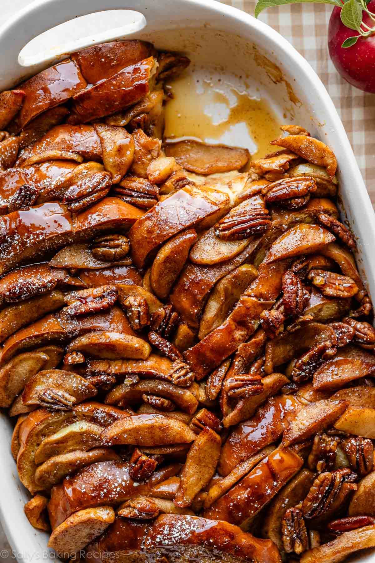 close-up overhead photo of apple french toast casserole with pecans on top.