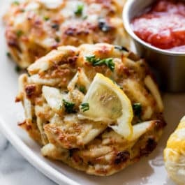 Maryland crab cakes with cocktail sauce and lemon