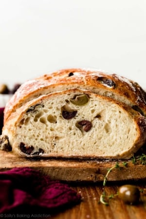 olive bread sliced from boule loaf