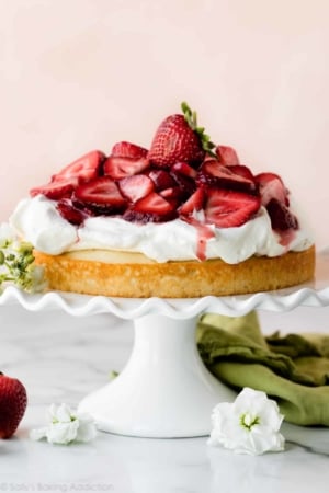 Strawberry shortcake cake on white cake stand