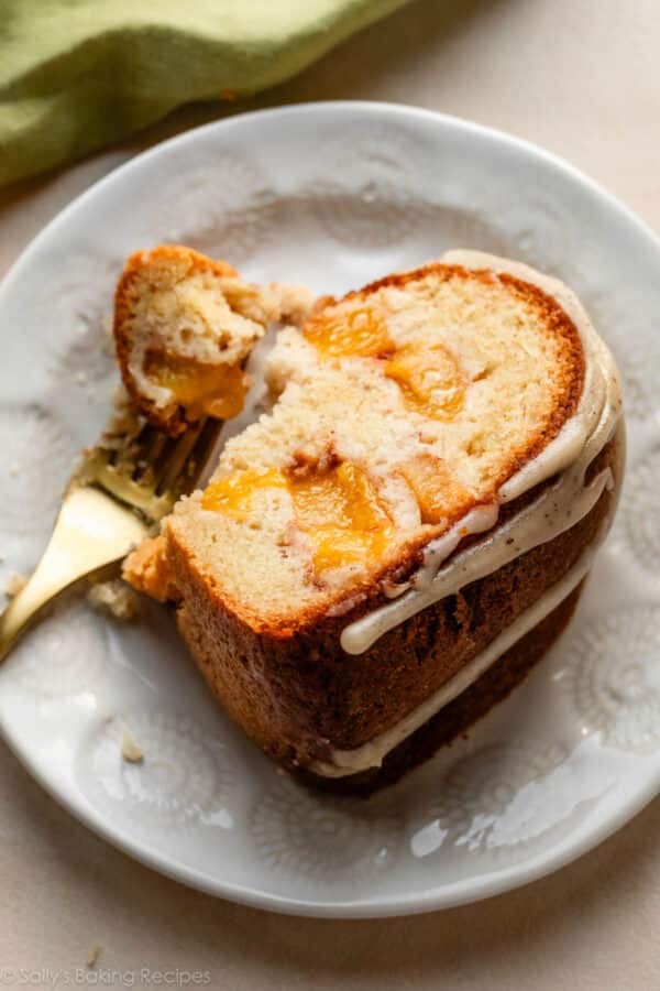 close-up of peach brown butter glazed bundt cake slice.