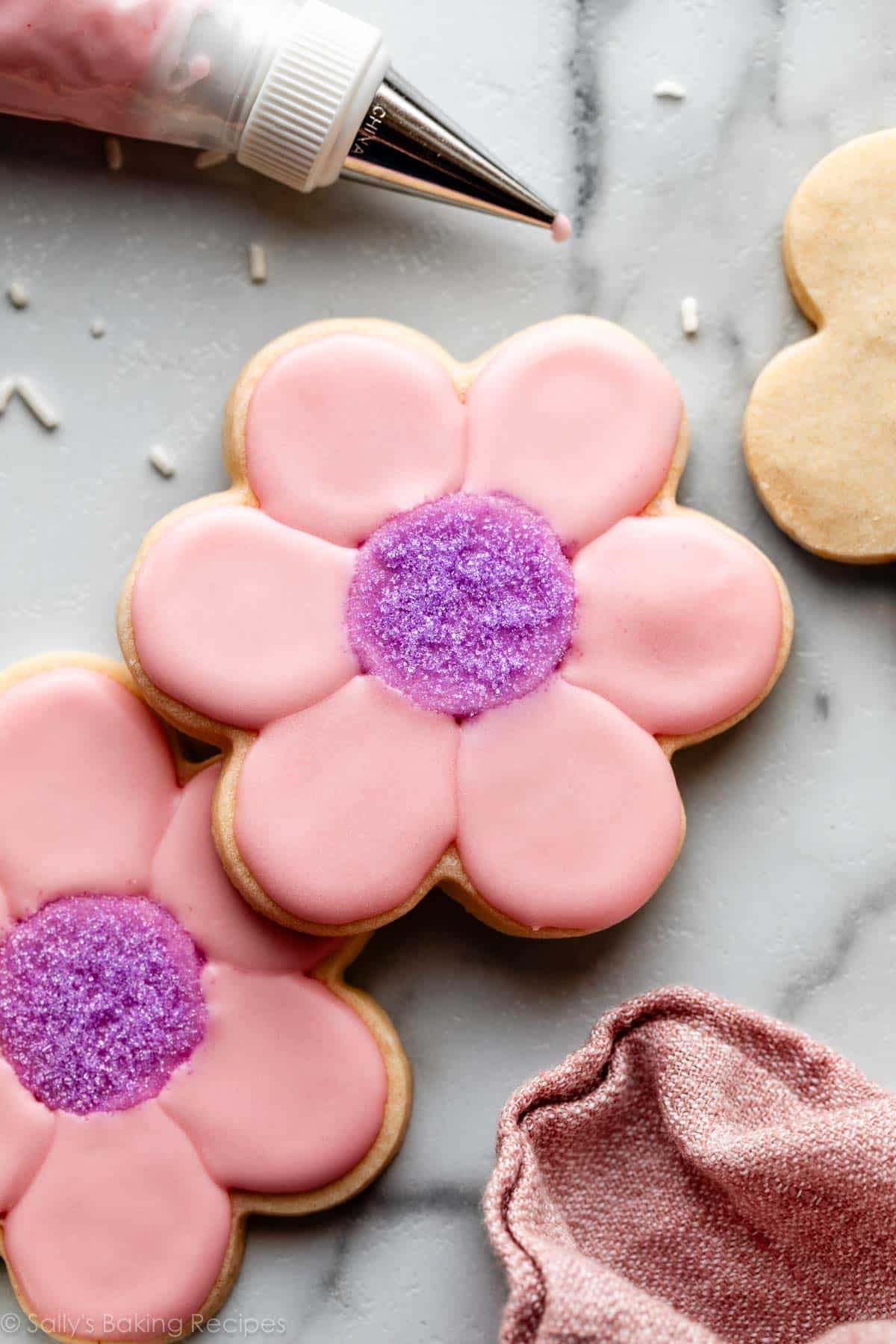 pink and purple decorated flower-shaped sugar cookies.