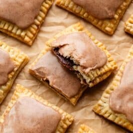 homemade brown sugar pop tart broken in half to show cinnamon filling.