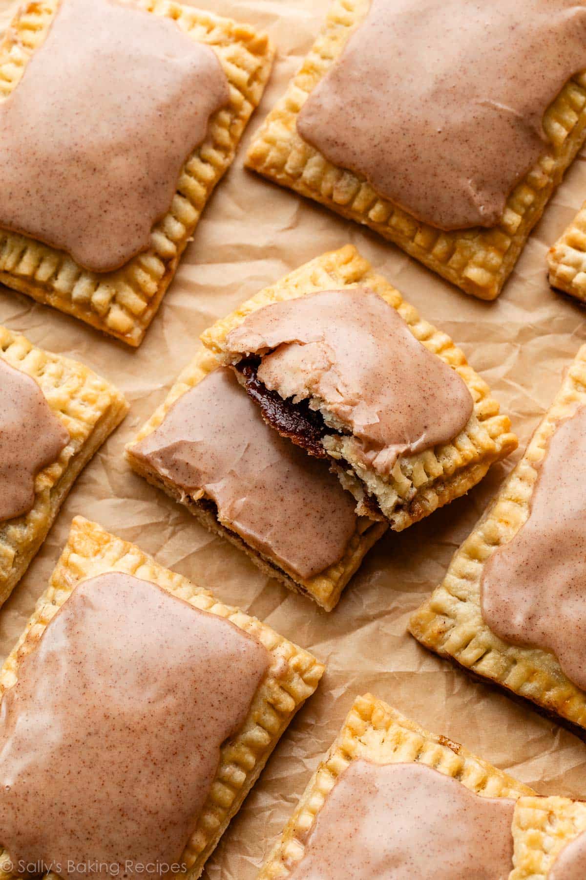 homemade brown sugar pop tart broken in half to show cinnamon filling.