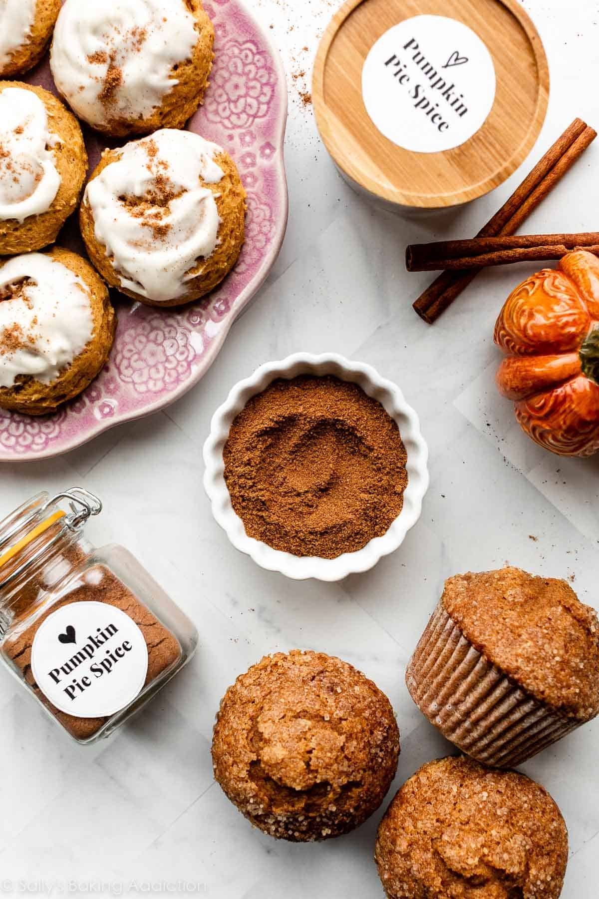 pumpkin cookies on purple plate and pumpkin muffins in the lower corner.