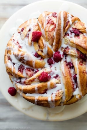 overhead image of raspberry danish twist on a cake stand