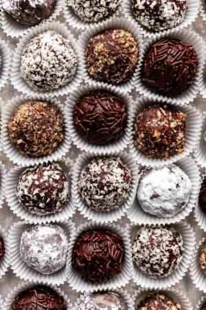 overhead close-up shot of rum balls coated in various toppings.