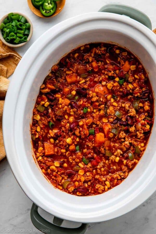 turkey chili in white slow cooker.