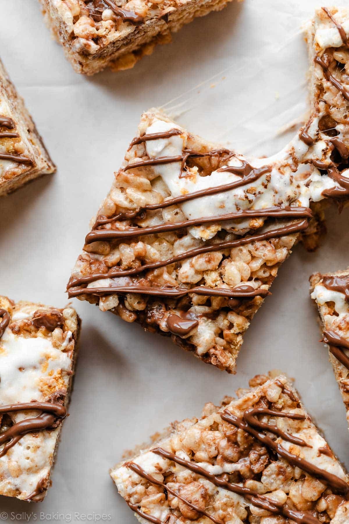 s'mores rice krispie treats with melted chocolate on top.