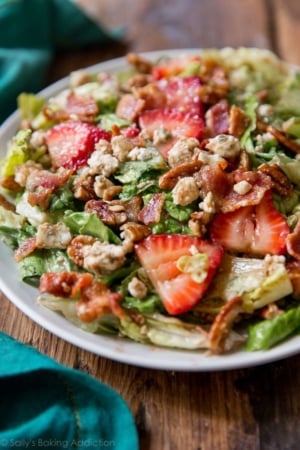 strawberry bacon salad on a white plate