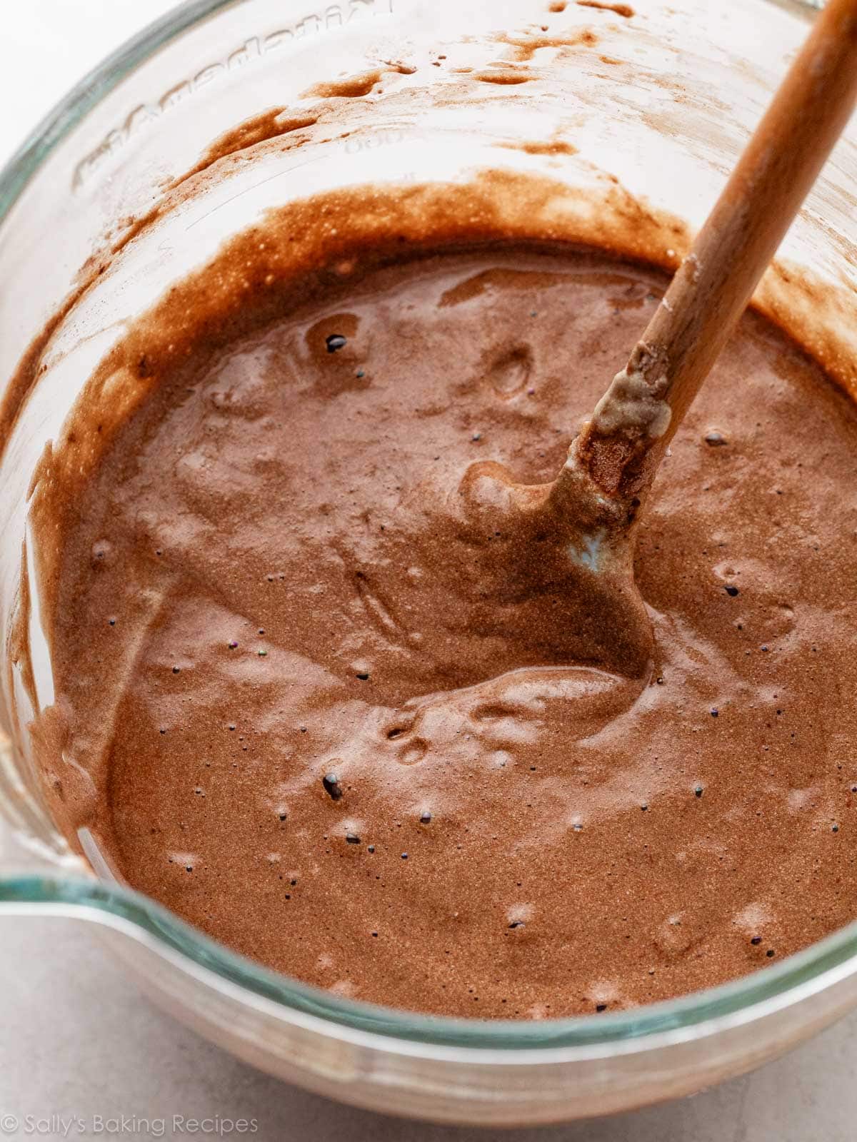 fluffy and airy cake batter in glass bowl.