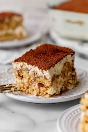 slices of tiramisu on white plates.