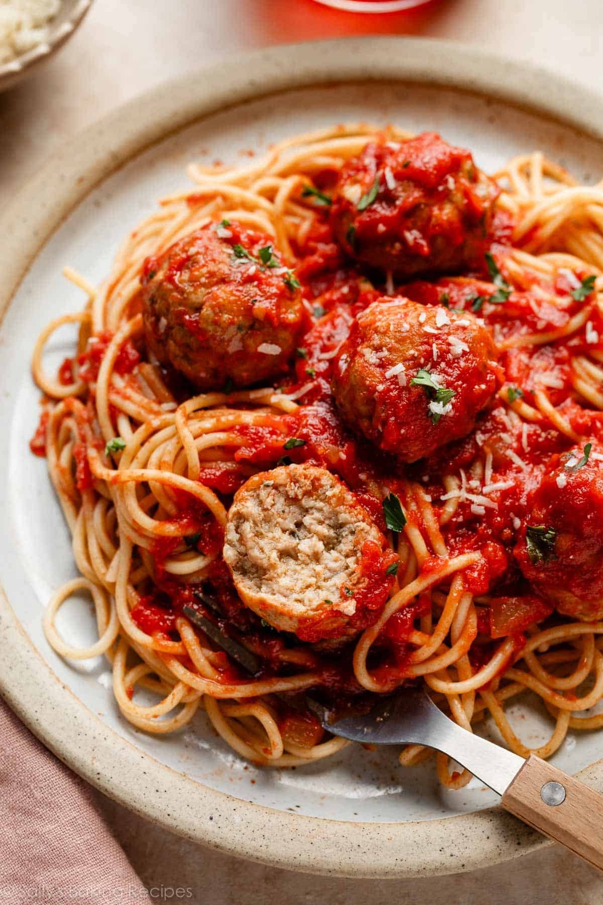 turkey meatballs in marinara sauce on spaghetti.