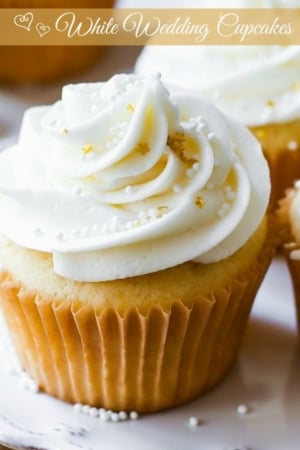 white wedding cupcakes on a white plate