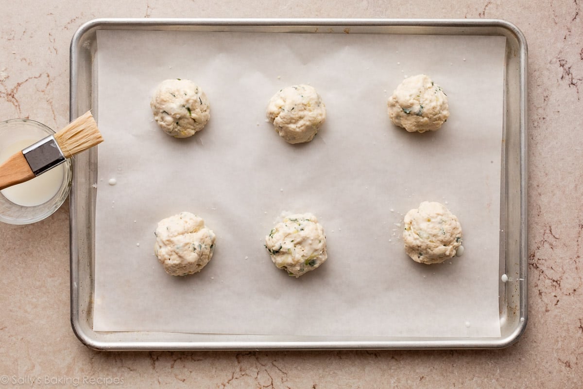 dough rounds on parchment paper-lined baking sheet.